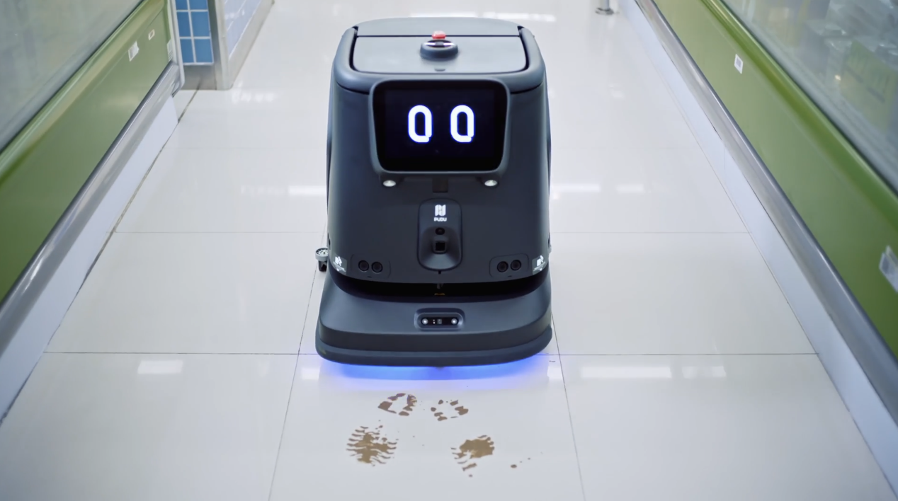 CC1 Pro autonomously detecting and cleaning muddy footprints in a corridor